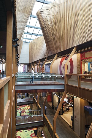 Internally, abundant timber panelling provides a contrast to the steel and concrete exterior